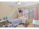 Charming bedroom with canopy bed, window, and hardwood floors at 4657 E Matt Dillon Trl, Cave Creek, AZ 85331