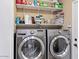 Laundry room with LG washer and dryer and shelving at 4657 E Matt Dillon Trl, Cave Creek, AZ 85331