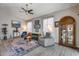 Relaxing living room with plush seating, large windows, and a stylish rug at 3055 N Red Mtn # 122, Mesa, AZ 85207