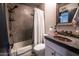 Bathroom with copper sink, concrete shower, and toilet at 2317 W Dobbins Rd, Phoenix, AZ 85041