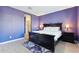 Spacious bedroom with a king-size bed and en-suite bathroom at 24884 N 171St Ln, Surprise, AZ 85387