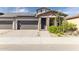Brick home with two-car garage and landscaping at 24884 N 171St Ln, Surprise, AZ 85387