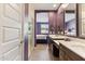 View of bathroom with double vanity and access to bedroom and shower at 24884 N 171St Ln, Surprise, AZ 85387