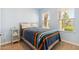 Cozy bedroom with wood-look flooring and natural light at 24884 N 171St Ln, Surprise, AZ 85387