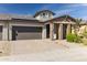 Modern home with solar panels and brick facade at 24884 N 171St Ln, Surprise, AZ 85387