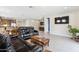 Living room with leather reclining sofas and a view of the kitchen at 24884 N 171St Ln, Surprise, AZ 85387