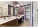 Bathroom with double vanity, large mirrors and walk-in shower at 24884 N 171St Ln, Surprise, AZ 85387