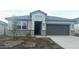 One-story home with gray exterior, stone accents, and a two-car garage at 48466 N Duran Way, Gold Canyon, AZ 85118
