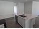 Modern kitchen island with white cabinets and a large sink at 48466 N Duran Way, Gold Canyon, AZ 85118