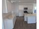 Modern kitchen with white cabinets, quartz counters, and island at 48466 N Duran Way, Gold Canyon, AZ 85118