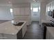 Modern kitchen island with white cabinets and quartz countertops at 48466 N Duran Way, Gold Canyon, AZ 85118