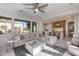 Open living room with views into kitchen and access to backyard at 2340 W Horsetail Trl, Phoenix, AZ 85085