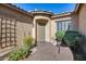 Front entry with brick pavers, a trellis, and lush landscaping at 2340 W Horsetail Trl, Phoenix, AZ 85085