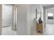 Bright hallway with wood-look tile flooring and built-in shelving at 2340 W Horsetail Trl, Phoenix, AZ 85085