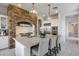 Modern kitchen with stone accent wall and stainless steel appliances at 2340 W Horsetail Trl, Phoenix, AZ 85085