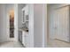 Well-equipped butler's pantry with glass-front cabinets, wine rack, and beverage refrigerator at 2340 W Horsetail Trl, Phoenix, AZ 85085