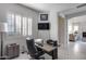 Home office with desk, chair, and view to living room at 2340 W Horsetail Trl, Phoenix, AZ 85085