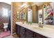 Bathroom with double vanity and patterned wall at 2340 W Horsetail Trl, Phoenix, AZ 85085