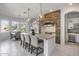 Spacious kitchen island with breakfast bar and stone feature wall at 2340 W Horsetail Trl, Phoenix, AZ 85085