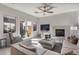 Living room with sectional sofa, fireplace, and access to backyard at 2340 W Horsetail Trl, Phoenix, AZ 85085