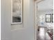 Hallway with art and view into bedroom with backyard access at 2340 W Horsetail Trl, Phoenix, AZ 85085