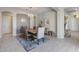 Bright dining area with wood dining table, modern light fixture, and access to kitchen at 2340 W Horsetail Trl, Phoenix, AZ 85085