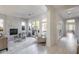 Open living room with marble fireplace, glass doors to backyard, and tile flooring at 2340 W Horsetail Trl, Phoenix, AZ 85085
