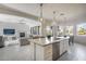 Open concept kitchen with large island and views to living areas at 2340 W Horsetail Trl, Phoenix, AZ 85085