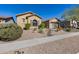 One-story house with desert landscaping and a large driveway at 2340 W Horsetail Trl, Phoenix, AZ 85085
