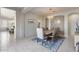 Elegant dining room with a rustic wood table, chandelier, and patterned rug at 2340 W Horsetail Trl, Phoenix, AZ 85085