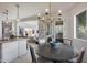 Kitchen dining area with round table and view to living room at 2340 W Horsetail Trl, Phoenix, AZ 85085
