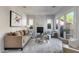 Living room boasts a marble fireplace, ample natural light, and comfortable seating at 2340 W Horsetail Trl, Phoenix, AZ 85085