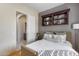 Cozy bedroom with a double bed and built-in shelving at 2340 W Horsetail Trl, Phoenix, AZ 85085