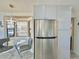 Modern kitchen with stainless steel refrigerator and breakfast nook at 8865 E Baseline Rd # 504, Mesa, AZ 85209