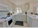 Bright kitchen featuring white cabinets and a marble countertop at 8865 E Baseline Rd # 504, Mesa, AZ 85209