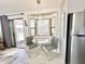 Small dining area with glass table and chairs at 8865 E Baseline Rd # 504, Mesa, AZ 85209