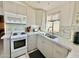 Well-equipped kitchen with white appliances and marble countertops at 8865 E Baseline Rd # 504, Mesa, AZ 85209
