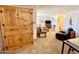 Living room with built-in wooden cabinet and seating area at 8865 E Baseline Rd # 504, Mesa, AZ 85209