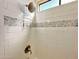 Updated bathroom with a new shower and tiled walls at 8865 E Baseline Rd # 504, Mesa, AZ 85209