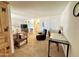 Living room with recliner, desk, and view of bathroom at 8865 E Baseline Rd # 504, Mesa, AZ 85209