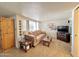 Living room with sofa, TV, and wood coffee table at 8865 E Baseline Rd # 504, Mesa, AZ 85209
