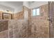 Large walk-in shower with tile surround at 2411 E Caldwell St, Phoenix, AZ 85042