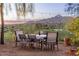 Outdoor patio dining area with mountain views and string lights at 4549 E Marion Way, Phoenix, AZ 85018