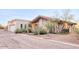 Single story home with attached garage and desert landscaping at 4549 E Marion Way, Phoenix, AZ 85018