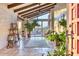 Bright living room with high ceilings, exposed beams, and large windows at 4549 E Marion Way, Phoenix, AZ 85018