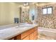 Updated bathroom with stone tile shower and granite countertop at 4549 E Marion Way, Phoenix, AZ 85018