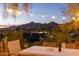 Evening view from patio with city lights and mountain backdrop at 4549 E Marion Way, Phoenix, AZ 85018