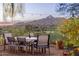 Scenic patio dining area with mountain views and string lights at 4549 E Marion Way, Phoenix, AZ 85018