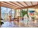 Bright dining area with large windows and access to a sunroom at 4549 E Marion Way, Phoenix, AZ 85018