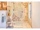 Spa-like shower with mosaic tile and built-in shelving at 4549 E Marion Way, Phoenix, AZ 85018